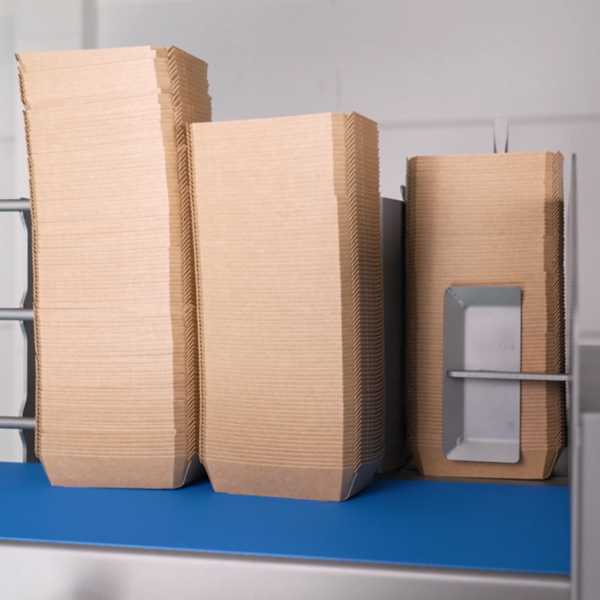 Freshtech Solutions Universal Denester V24 stacking cardboard trays being loaded - square image